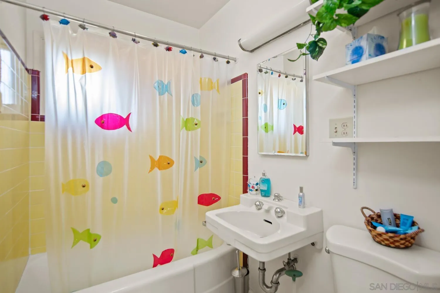 911 B Avenue Coronado, CA 92118 - Photo 42 of 45 a bathroom with a sink and a mirror