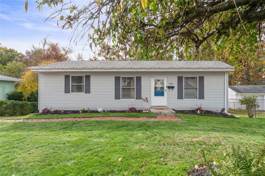 420 Donnell Road Lower Burrell, PA 15068 - Photo 1 of 33 a front view of a house with a garden and yard