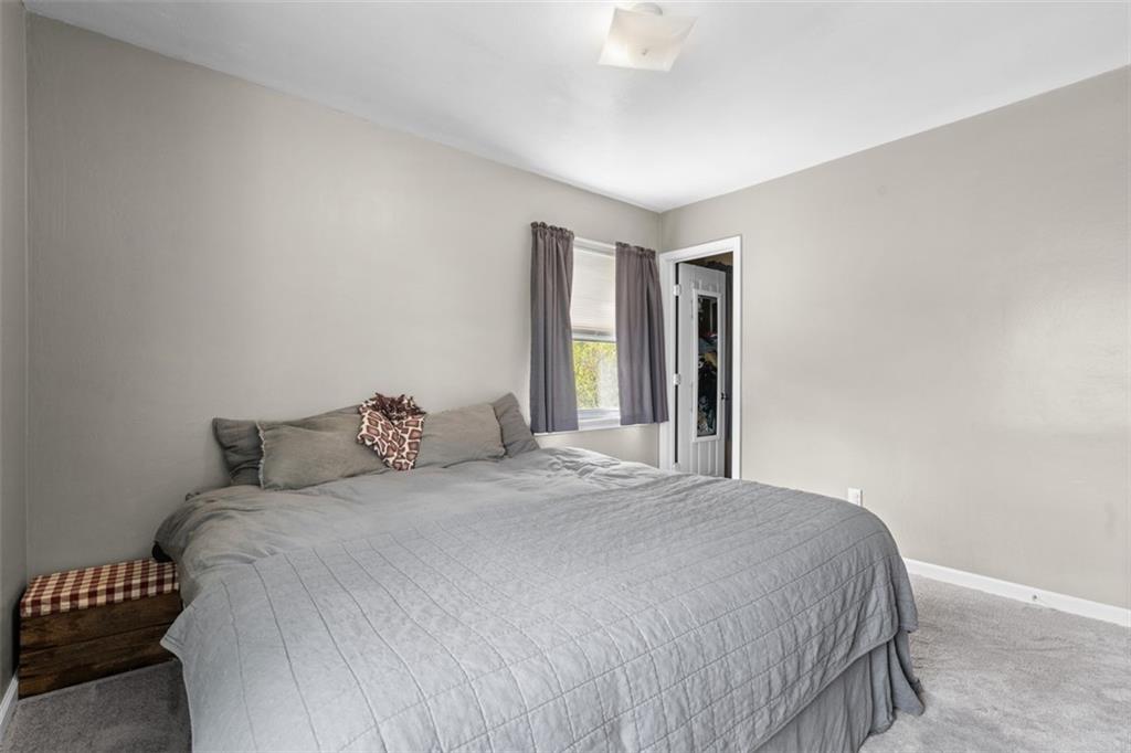 420 Donnell Road Lower Burrell, PA 15068 - Photo 14 of 33 a large bed sitting in a bedroom next to a window and a bathroom