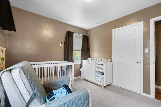 a bedroom with furniture and a window