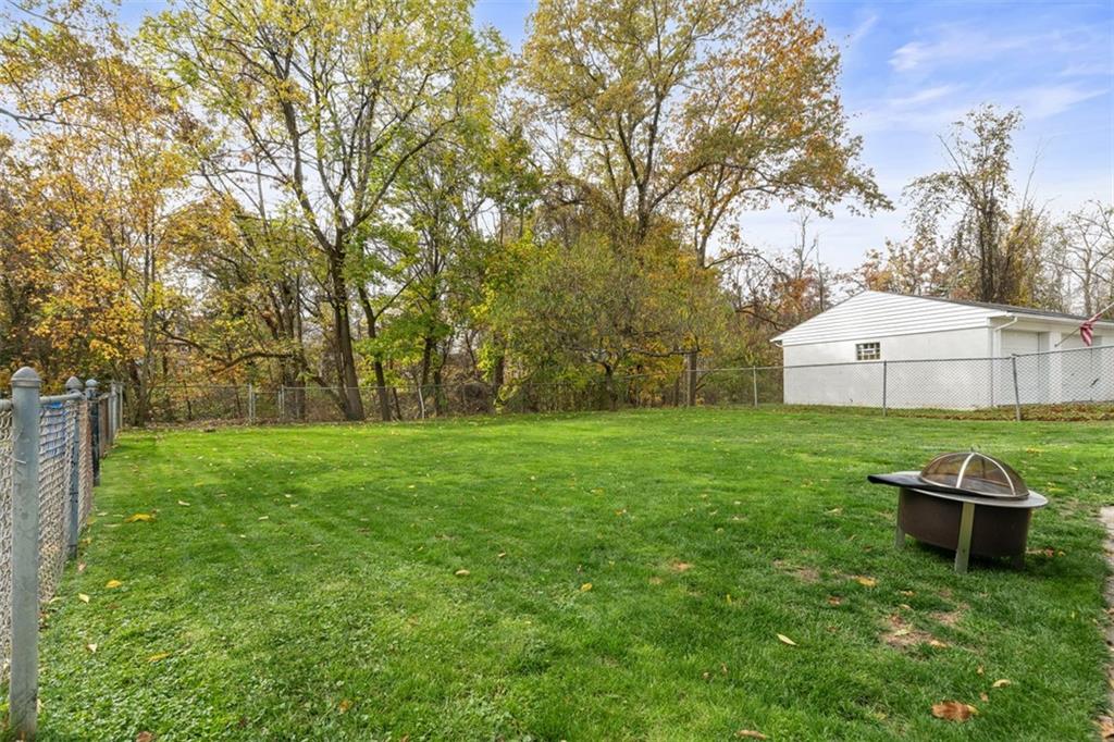 420 Donnell Road Lower Burrell, PA 15068 - Photo 31 of 33 a view of a backyard with table and chairs and a tree