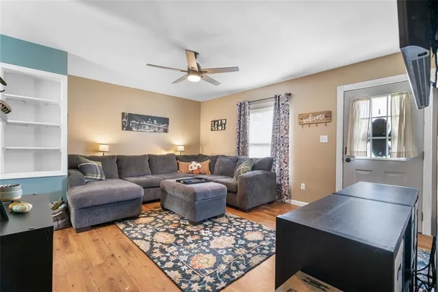 a living room with furniture rug and window
