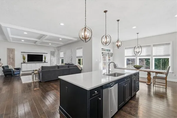 a view of kitchen and dining area with wooden floor