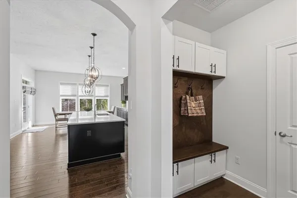 a view of entryway with wooden floor