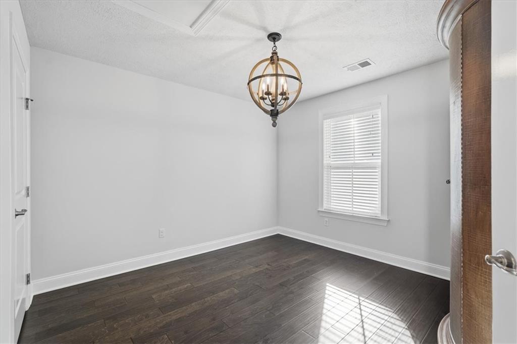 147 Seneca Place Mars, PA 16046 - Photo 26 of 44 an empty room with wooden floor and a window