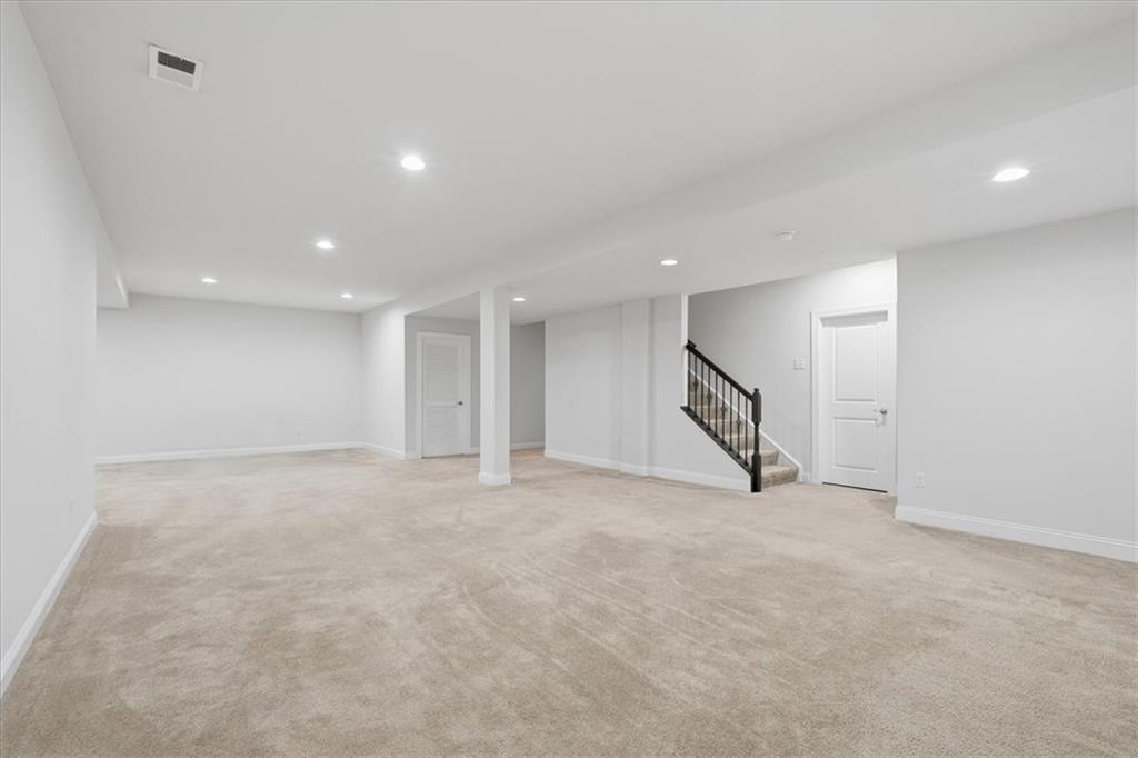 147 Seneca Place Mars, PA 16046 - Photo 31 of 44 an empty room with a projector & windows