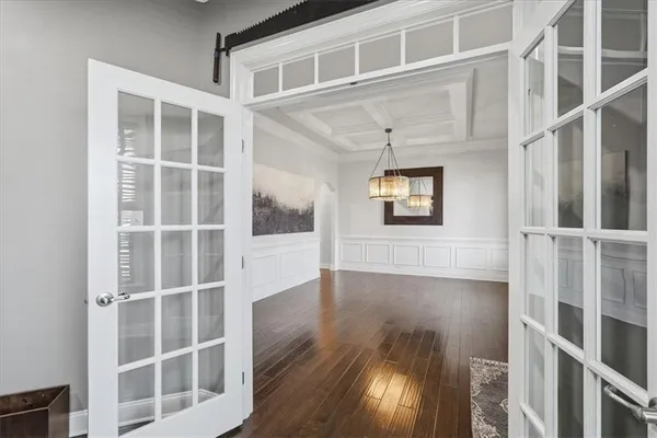 a view of workspace with wooden floor and windows