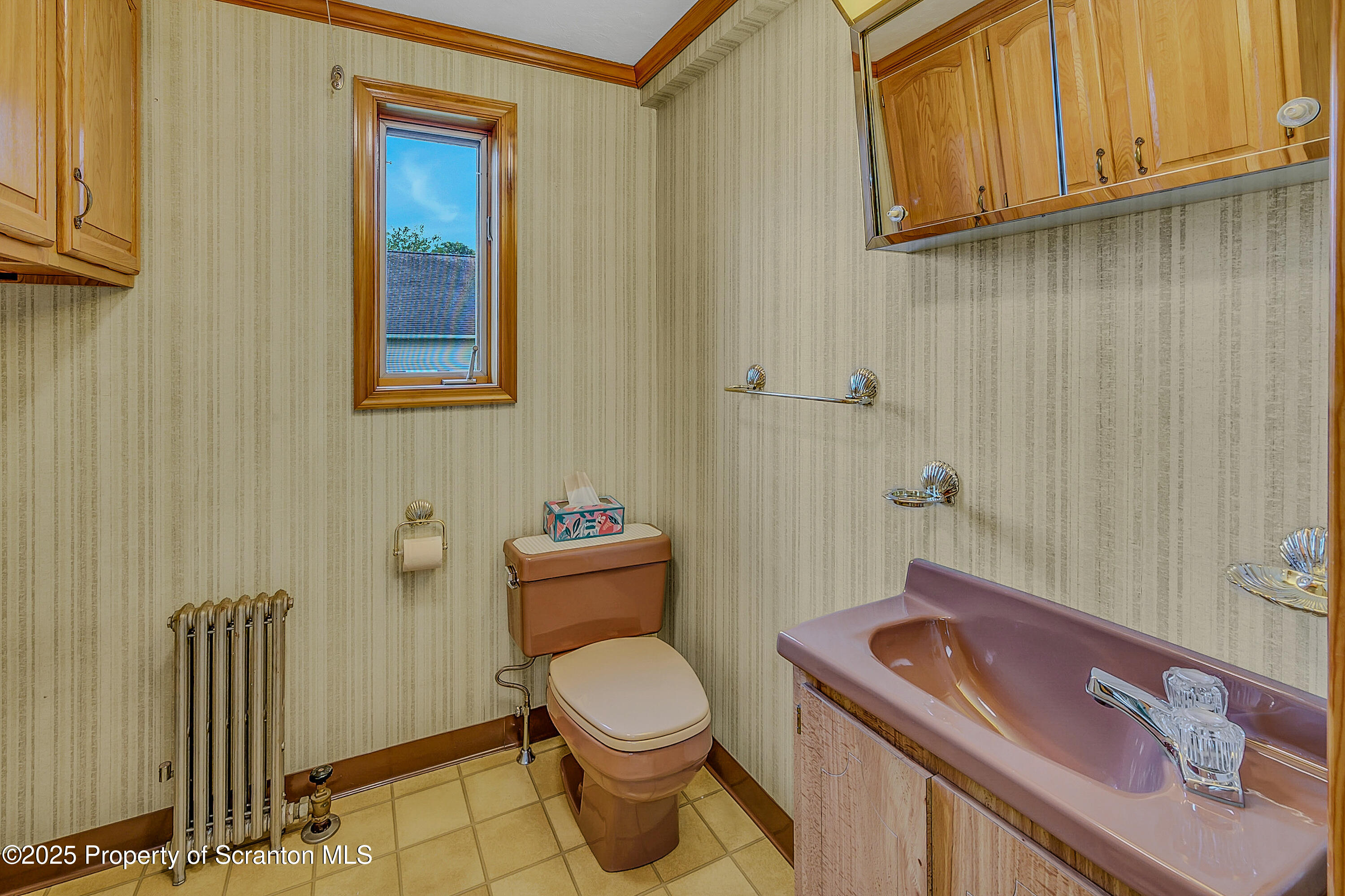 441 14th Avenue Scranton, PA 18504 - Photo 12 of 25 a bathroom with a sink a toilet and mirror