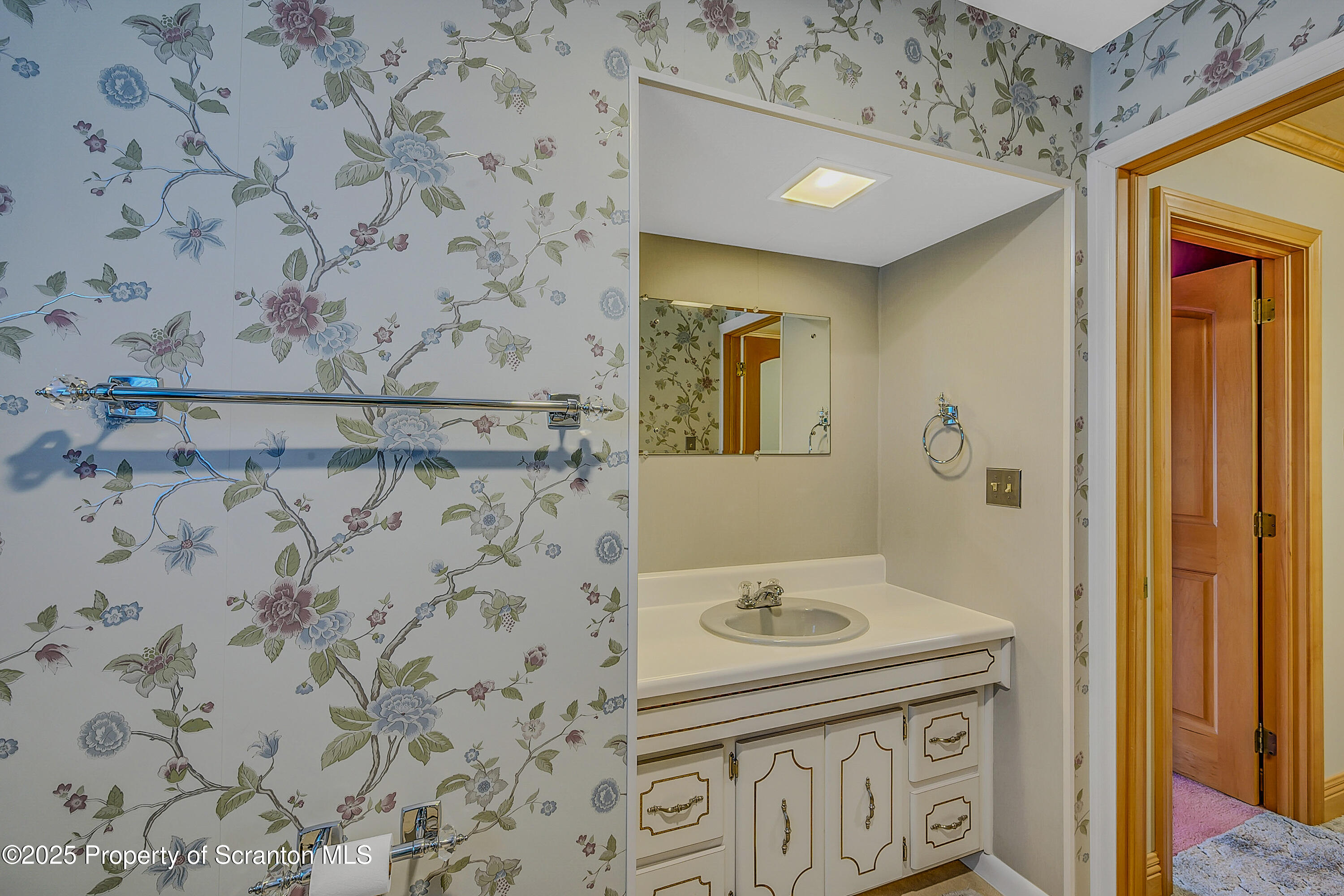 441 14th Avenue Scranton, PA 18504 - Photo 15 of 25 a bathroom with a granite countertop sink and a mirror