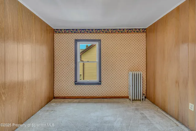 a view of a room with wooden walls