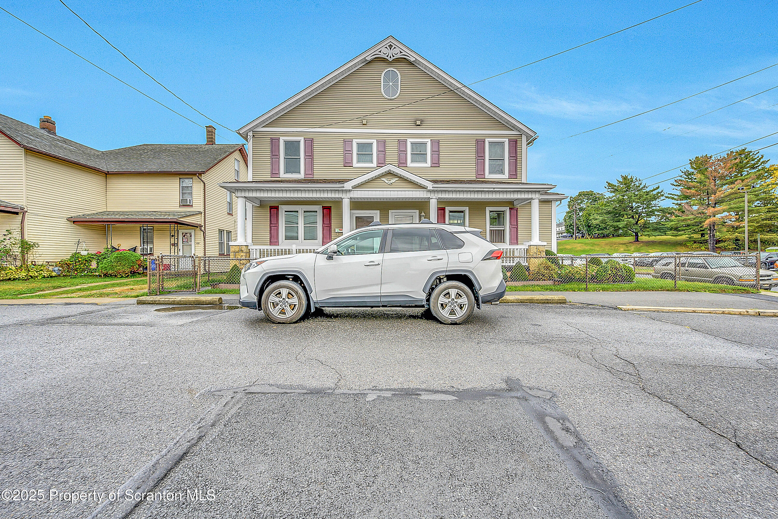 441 14th Avenue Scranton, PA 18504 - Photo 23 of 25 a car parked in front of a house