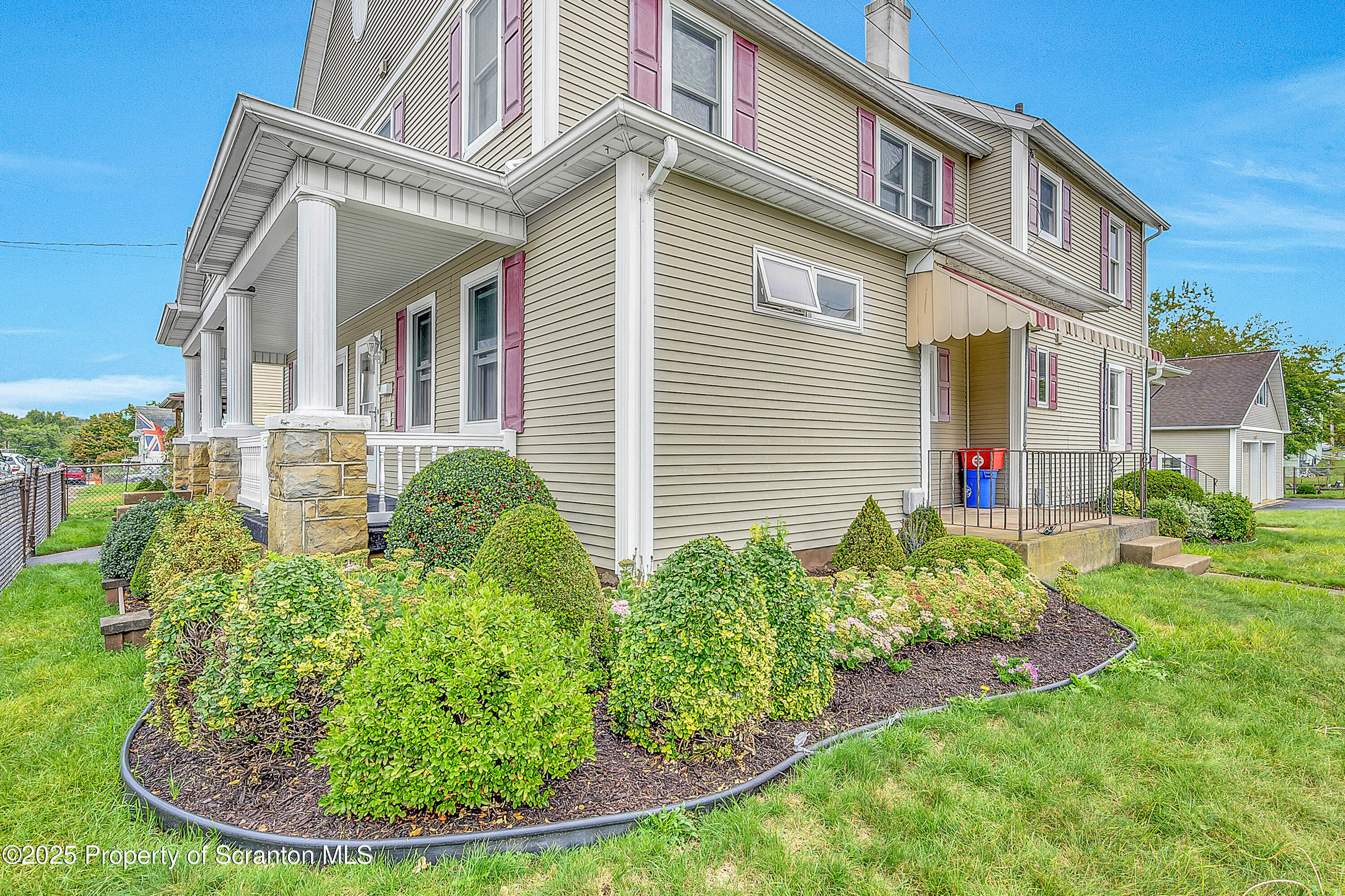 441 14th Avenue Scranton, PA 18504 - Photo 25 of 25 a view of a house with a small yard plants and large tree