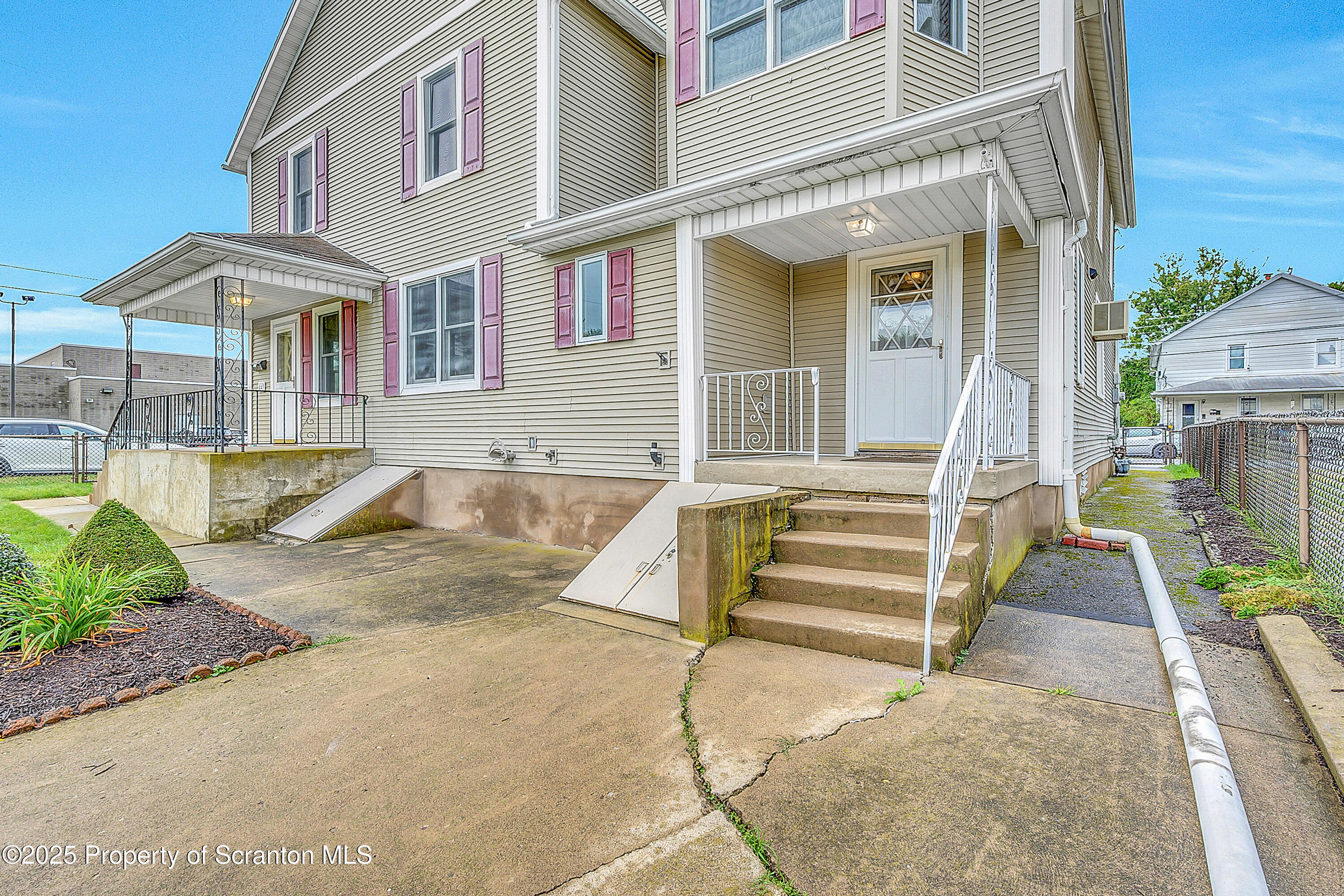 441 14th Avenue Scranton, PA 18504 - Photo 3 of 25 front view of a house with a stairs