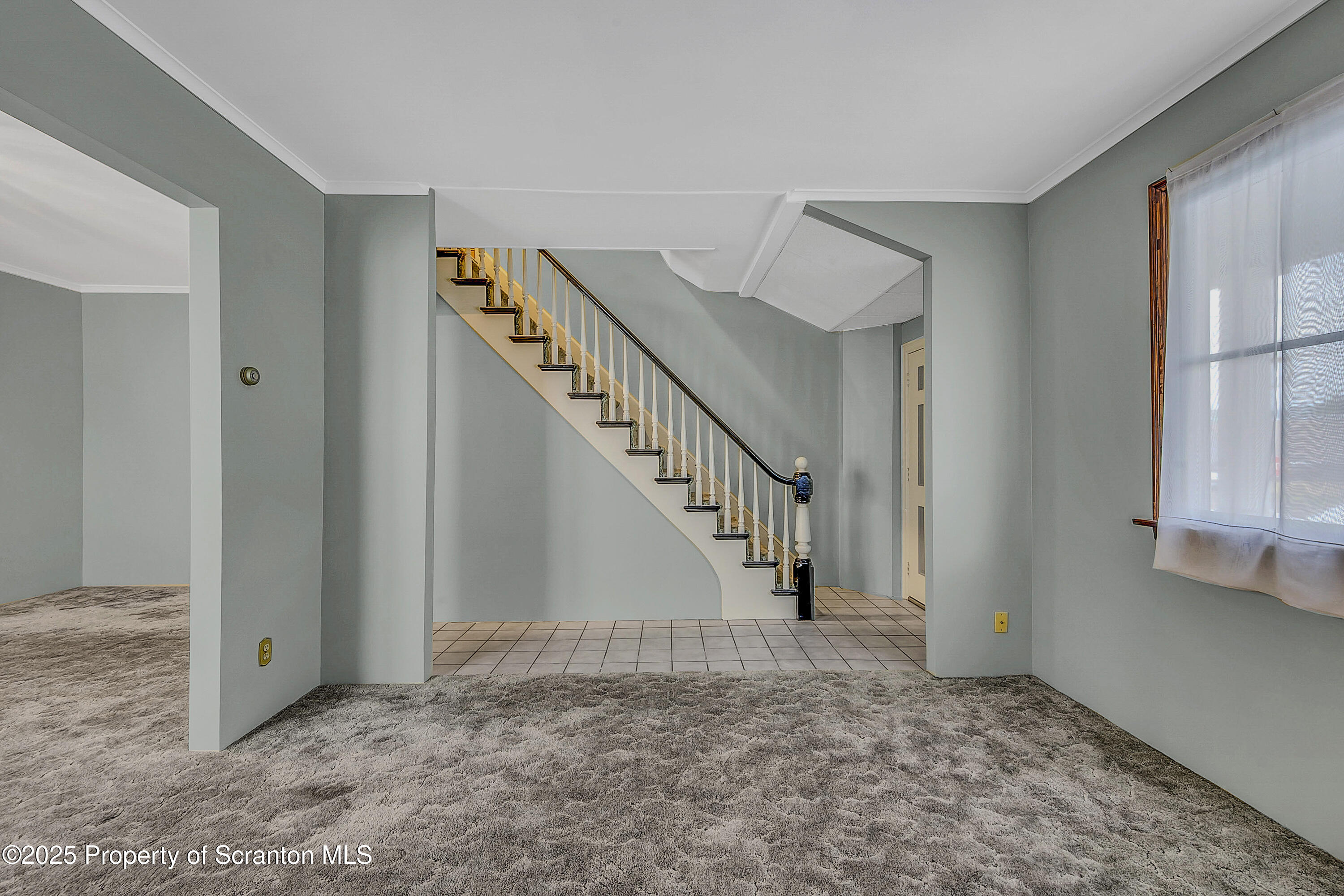 441 14th Avenue Scranton, PA 18504 - Photo 5 of 25 a view of staircase with white walls and stairs