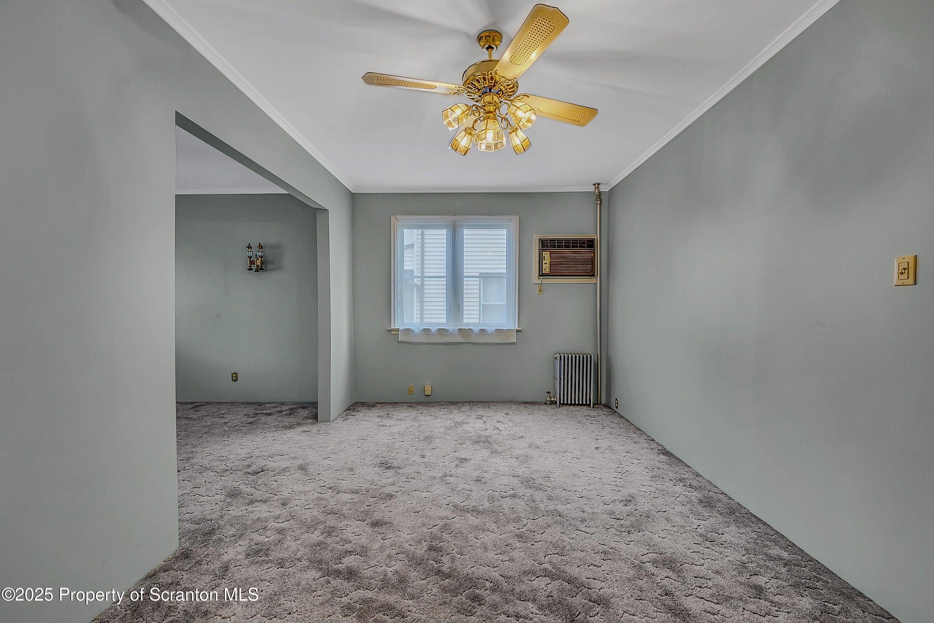 441 14th Avenue Scranton, PA 18504 - Photo 8 of 25 an empty room with a window and a ceiling fan