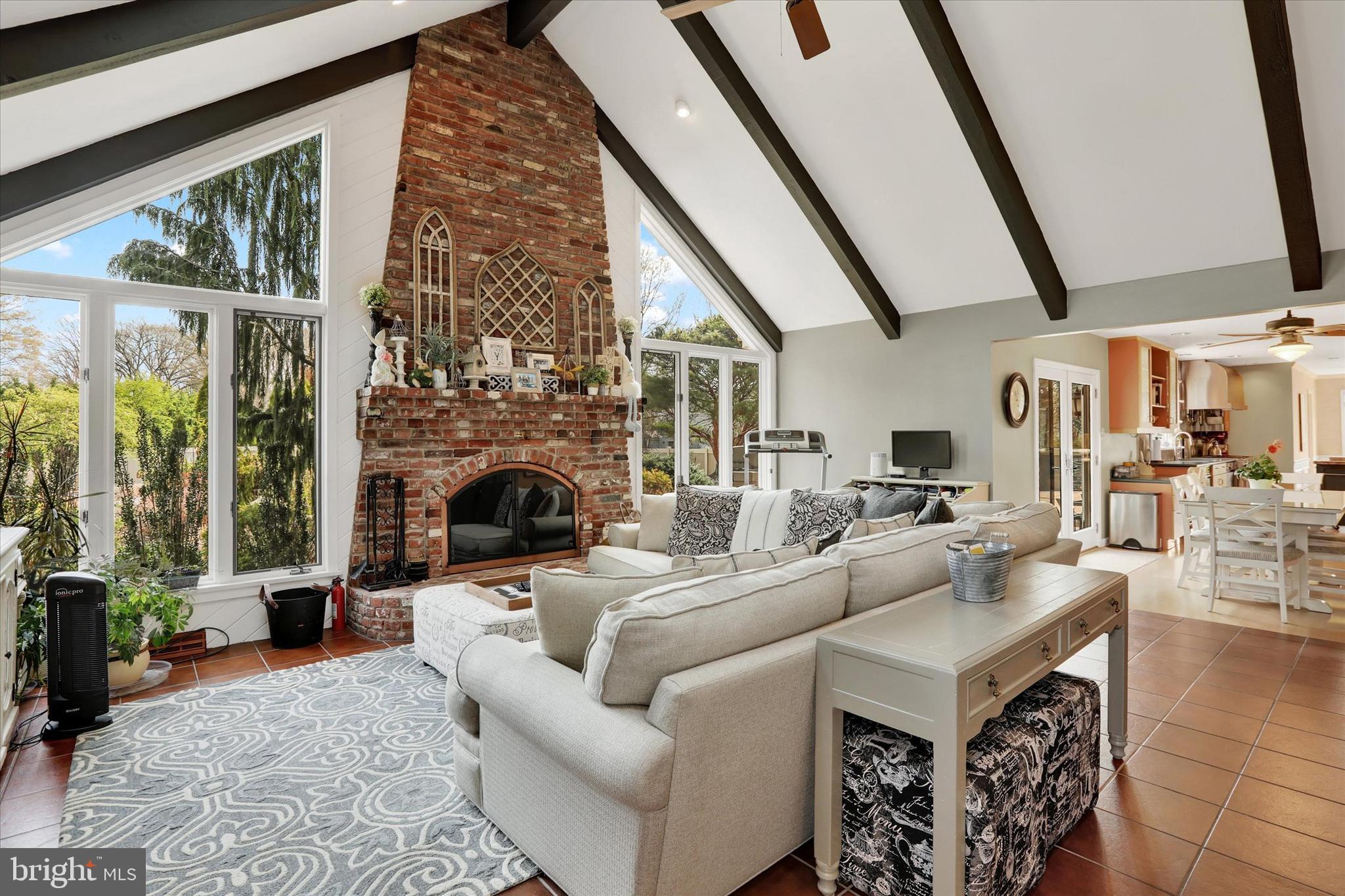 414 Trend Road Yardley, PA 19067 - Photo 13 of 57 a living room with furniture large window and a fireplace