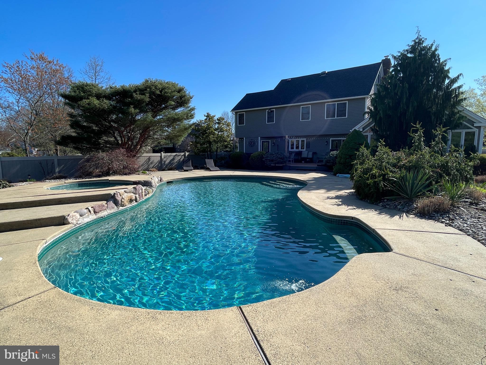 414 Trend Road Yardley, PA 19067 - Photo 47 of 57 a view of a swimming pool with a lounge chair