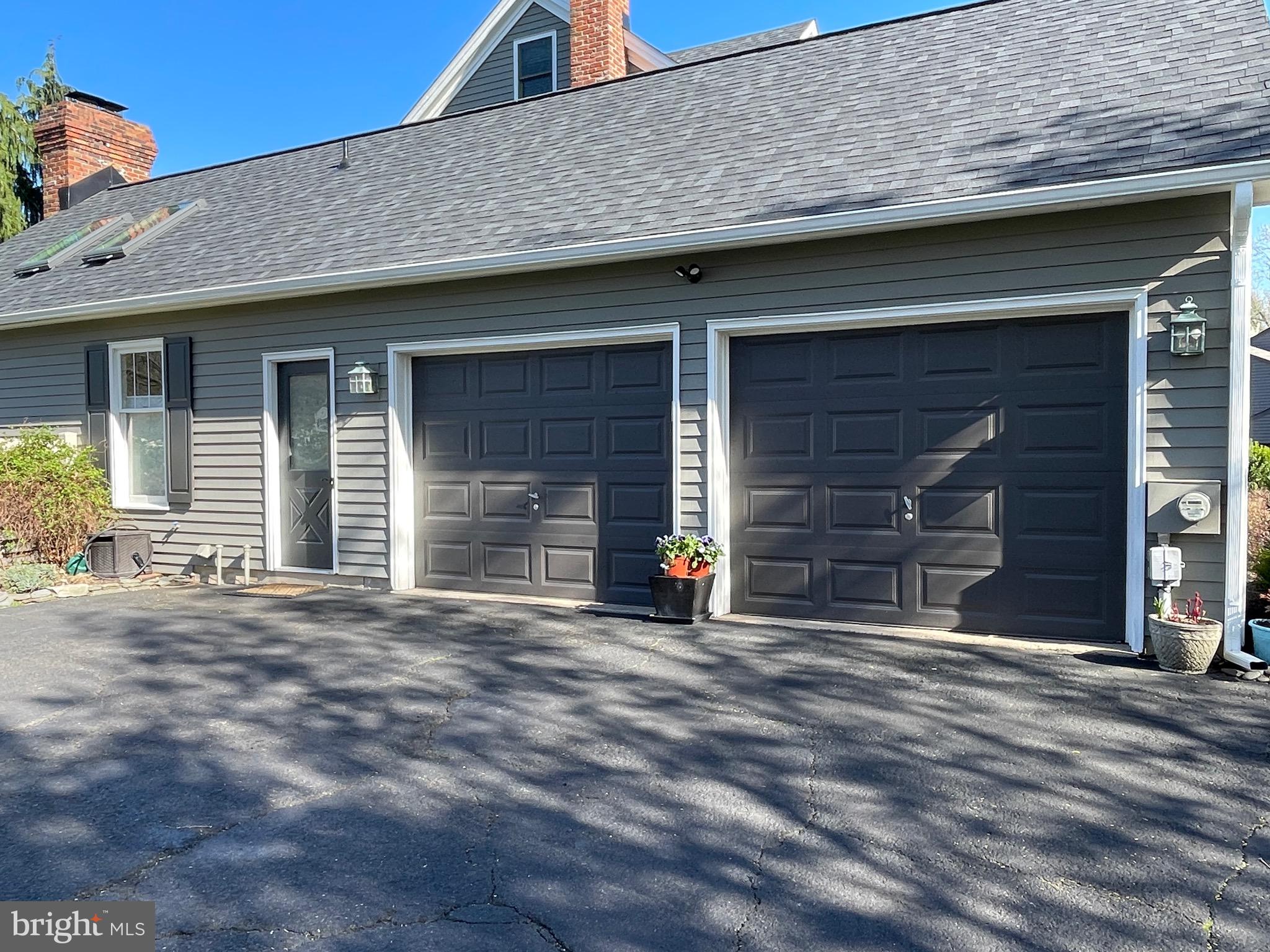 414 Trend Road Yardley, PA 19067 - Photo 55 of 57 a front view of a house with a garage