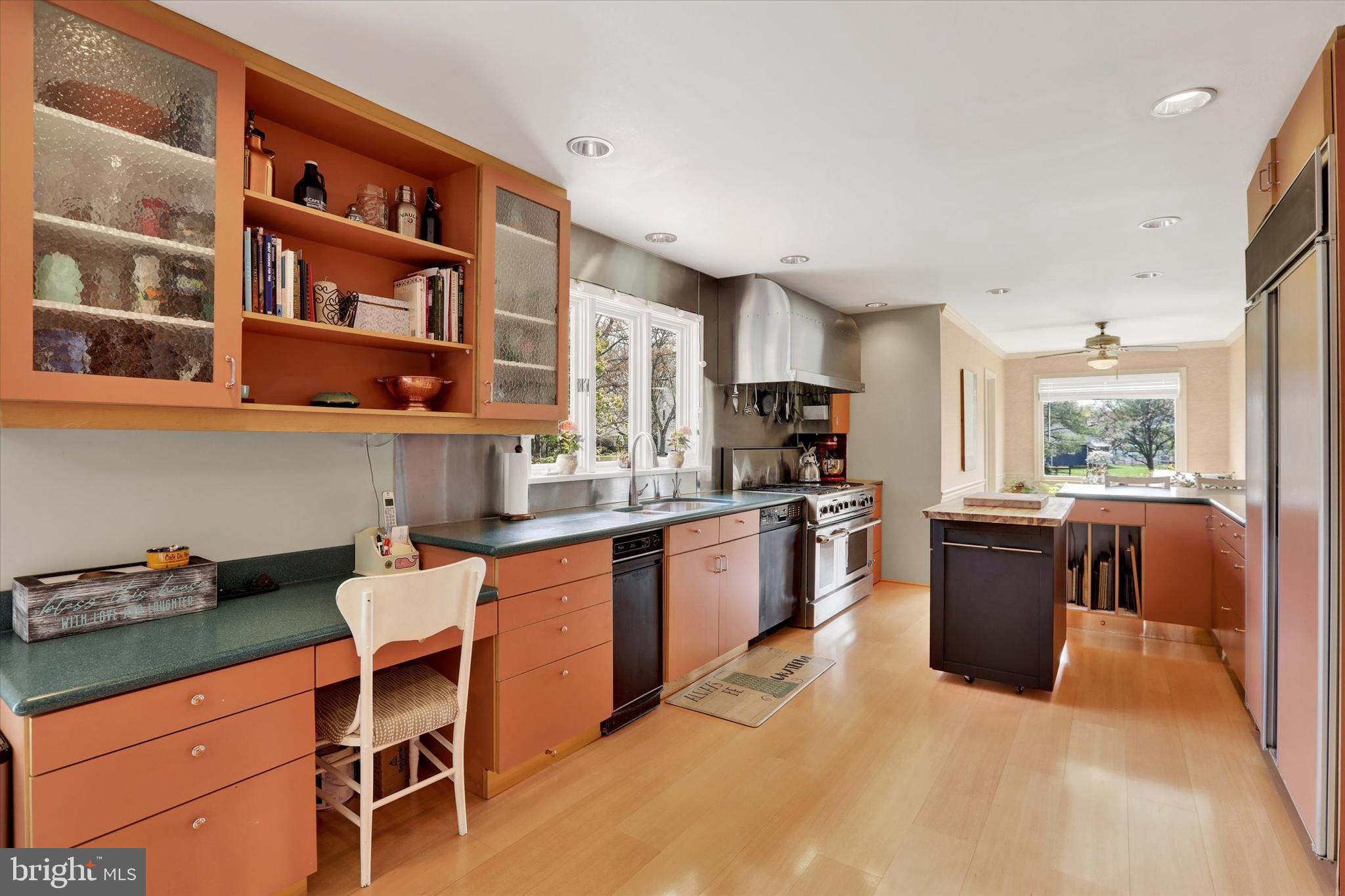 414 Trend Road Yardley, PA 19067 - Photo 6 of 57 a kitchen with a refrigerator and wooden cabinets