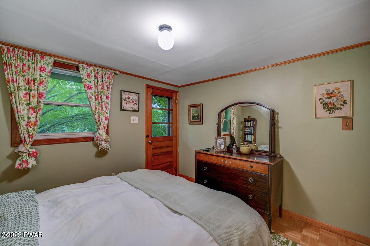 20 Wash Road Waymart, PA 18472 - Photo 29 of 49 a bedroom with a bed and a dresser next to a window