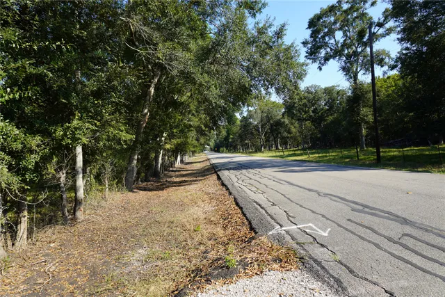 a view of a road with a yard