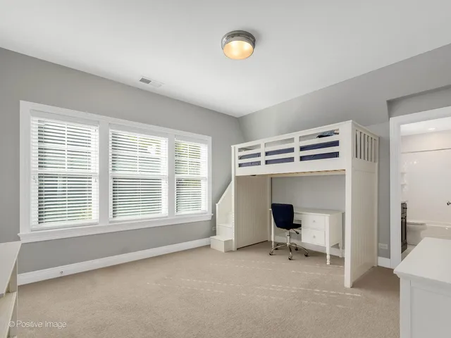 a workspace with furniture and a window
