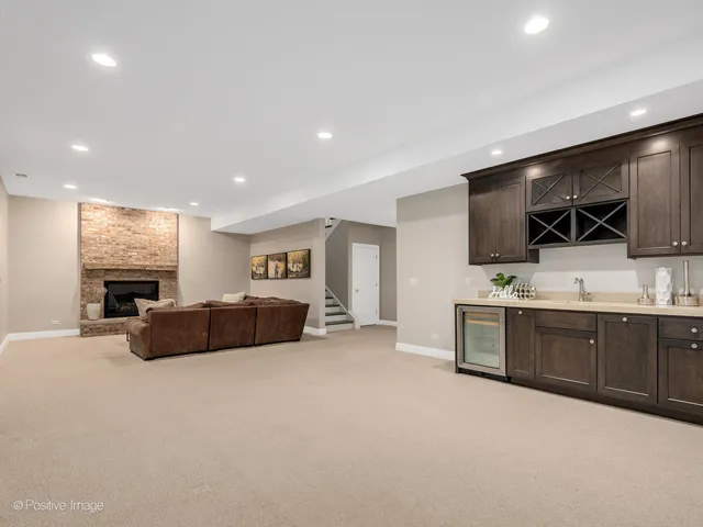 a large bedroom with a bed and a television in it