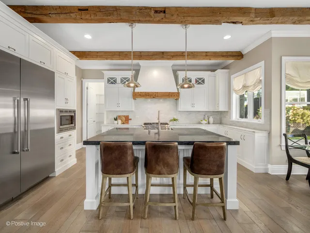 a kitchen with a table and chairs in it