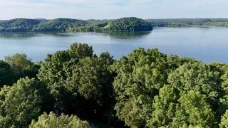 a view of a lake with a mountain in the background and lake view