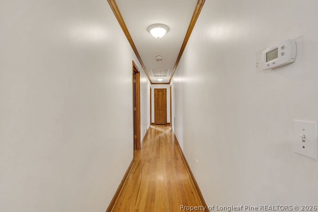 698 Sheriff Watson Road Sanford, NC 27332 - Photo 18 of 41 a view of a hallway with wooden floor