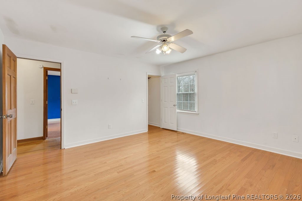 698 Sheriff Watson Road Sanford, NC 27332 - Photo 30 of 41 a view of an empty room with wooden floor