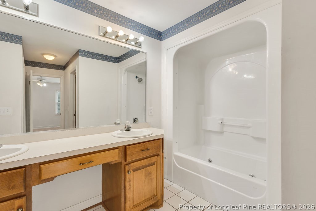 698 Sheriff Watson Road Sanford, NC 27332 - Photo 33 of 41 a bathroom with a sink a mirror and a bathtub