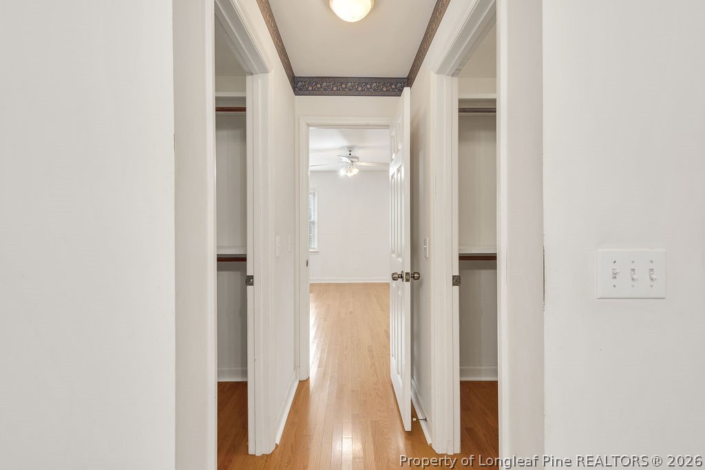 698 Sheriff Watson Road Sanford, NC 27332 - Photo 35 of 41 a view of a hallway with wooden floor and closet