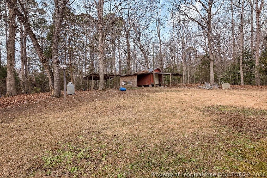 698 Sheriff Watson Road Sanford, NC 27332 - Photo 38 of 41 a view of outdoor space with deck and trees