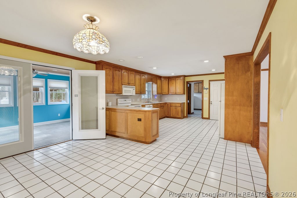 698 Sheriff Watson Road Sanford, NC 27332 - Photo 6 of 41 a kitchen with stainless steel appliances kitchen island granite countertop a refrigerator and a sink