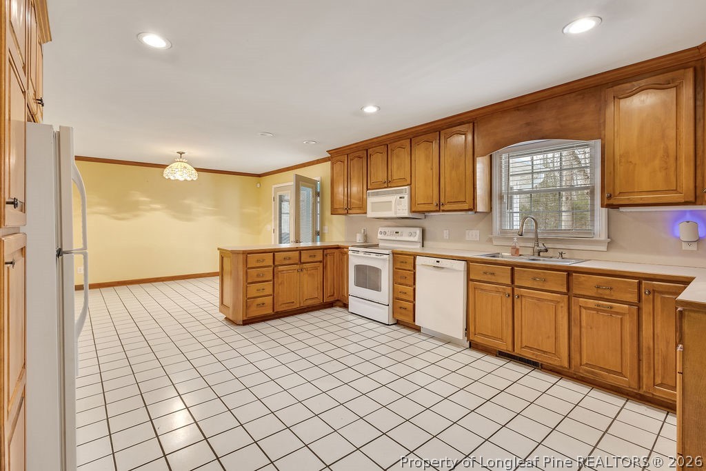 698 Sheriff Watson Road Sanford, NC 27332 - Photo 9 of 41 a kitchen with stainless steel appliances granite countertop a sink and cabinets