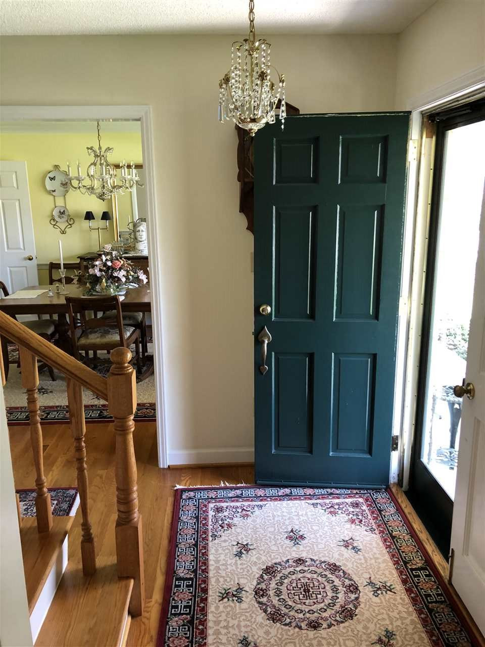 3907 Converse Drive Raleigh, NC 27609 - Photo 13 of 30 Double Front doors and wood storm doors. note- this light fixture as well as the dining room will be replaced. Entrance Foyer
