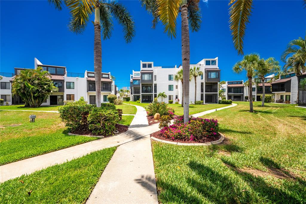 2955 North Beach Road, Unit B614 Englewood, FL 34223 - Photo 48 of 67 a view of a house with swimming pool and yard