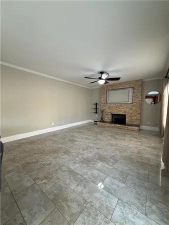 a view of empty room with a fireplace