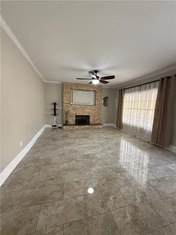 a kitchen with a refrigerator coffee maker on the counter space