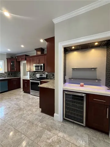 a view of room with a sink and a mirror