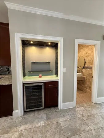 a bathroom with a sink a mirror and shower