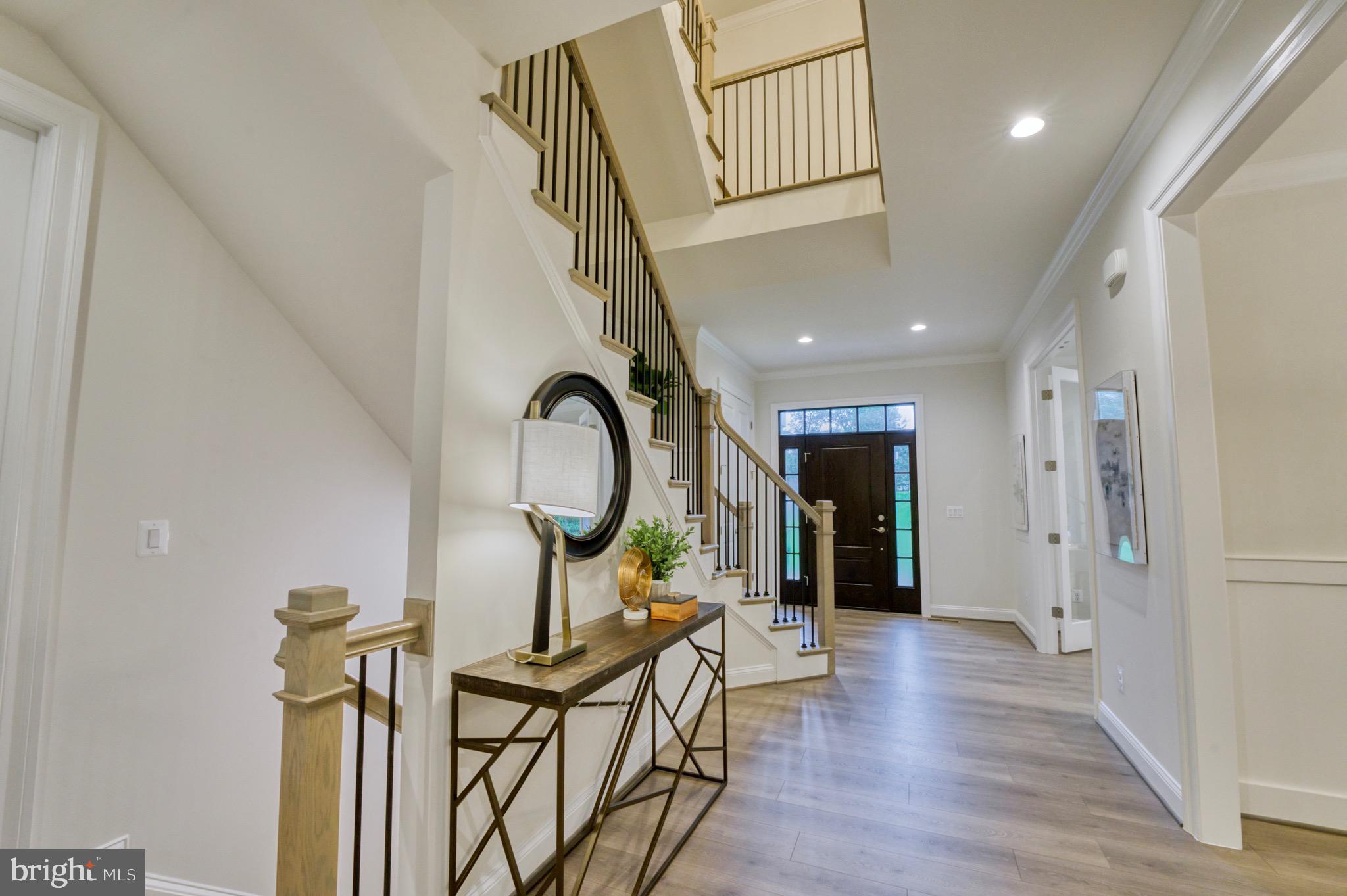 2236 Laurel Ridge Road Vienna, VA 22181 - Photo 11 of 78 a view of a hallway with wooden floor and entryway
