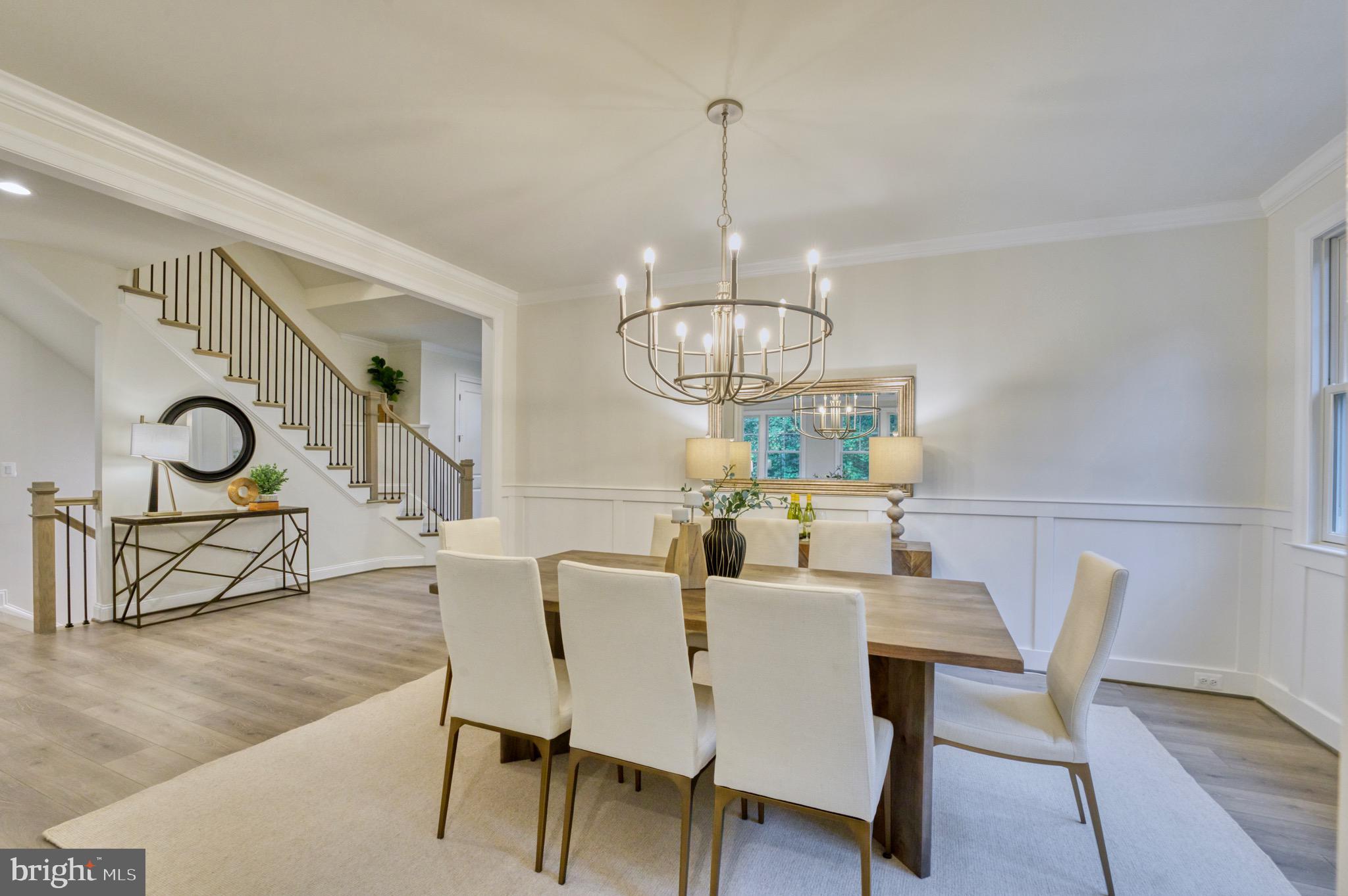 2236 Laurel Ridge Road Vienna, VA 22181 - Photo 13 of 78 a view of a dining room with furniture wooden floor and chandelier