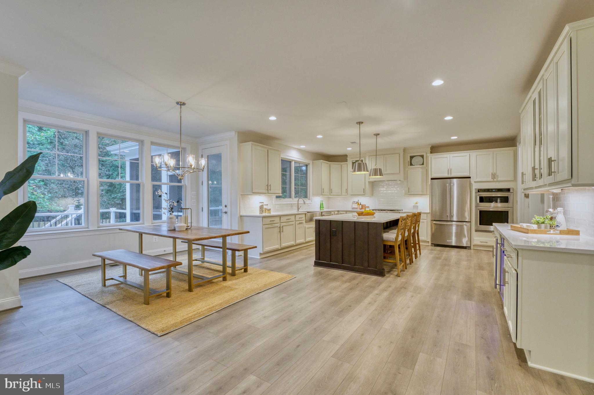 2236 Laurel Ridge Road Vienna, VA 22181 - Photo 19 of 78 a living room with stainless steel appliances furniture wooden floor and a kitchen view