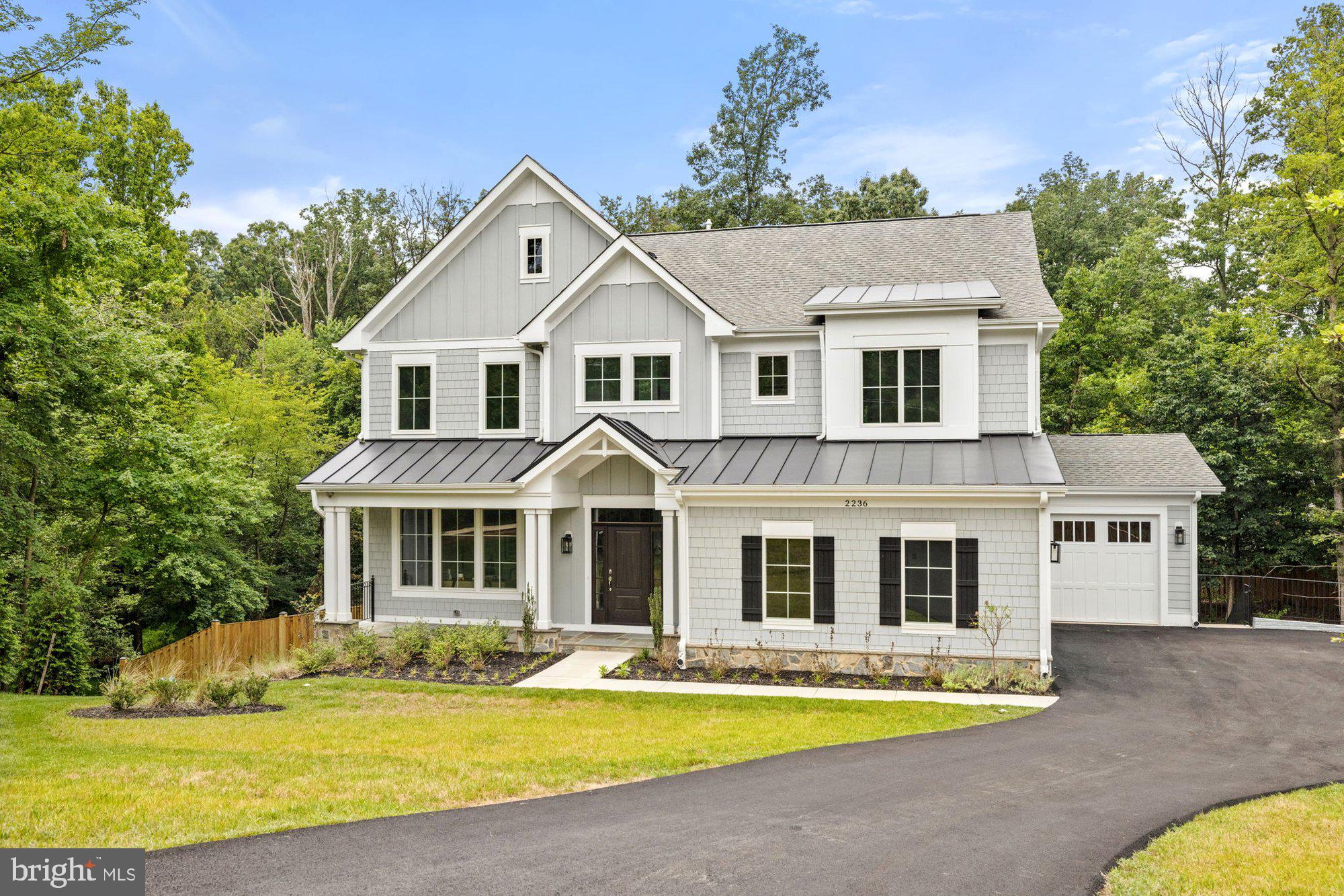 2236 Laurel Ridge Road Vienna, VA 22181 - Photo 2 of 78 a front view of a house with a yard outdoor seating and garage