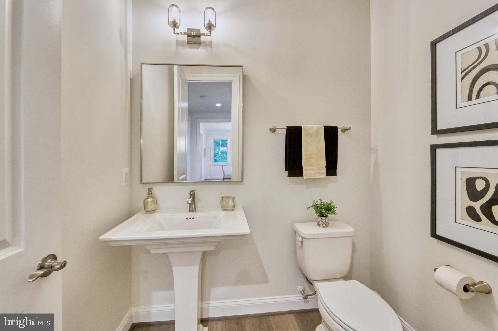 2236 Laurel Ridge Road Vienna, VA 22181 - Photo 27 of 78 a bathroom with a toilet sink and mirror