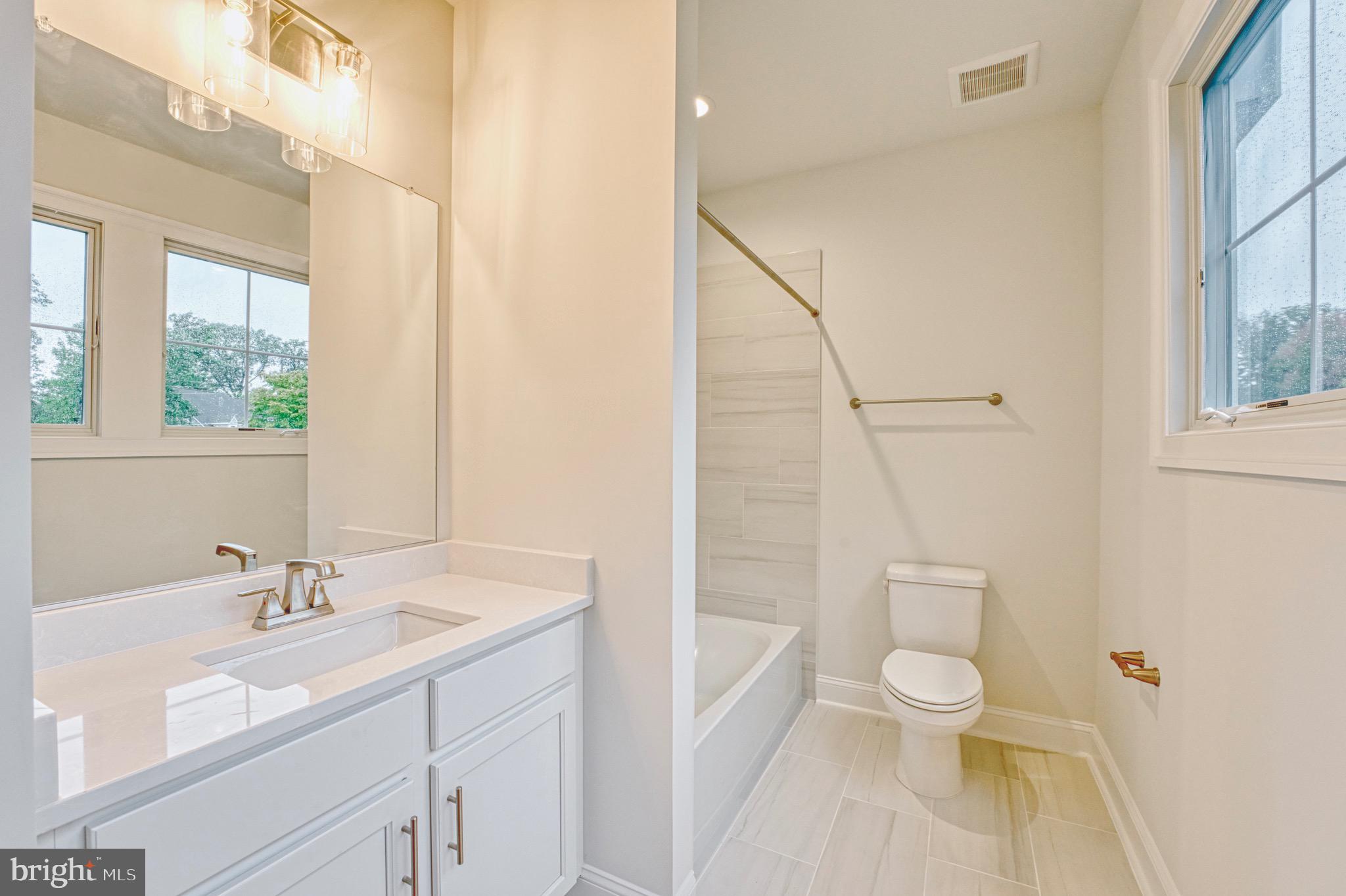 2236 Laurel Ridge Road Vienna, VA 22181 - Photo 38 of 78 a bathroom with a sink toilet and shower