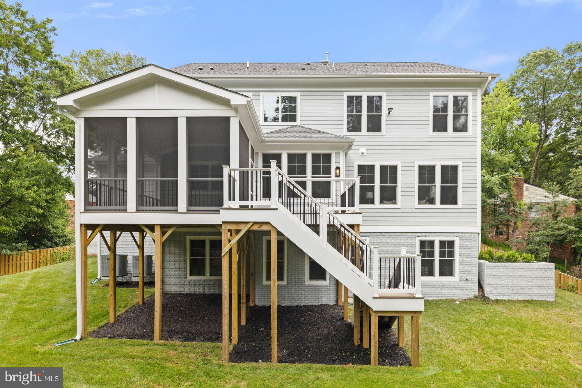 2236 Laurel Ridge Road Vienna, VA 22181 - Photo 6 of 78 a front view of a house with a yard table and chairs