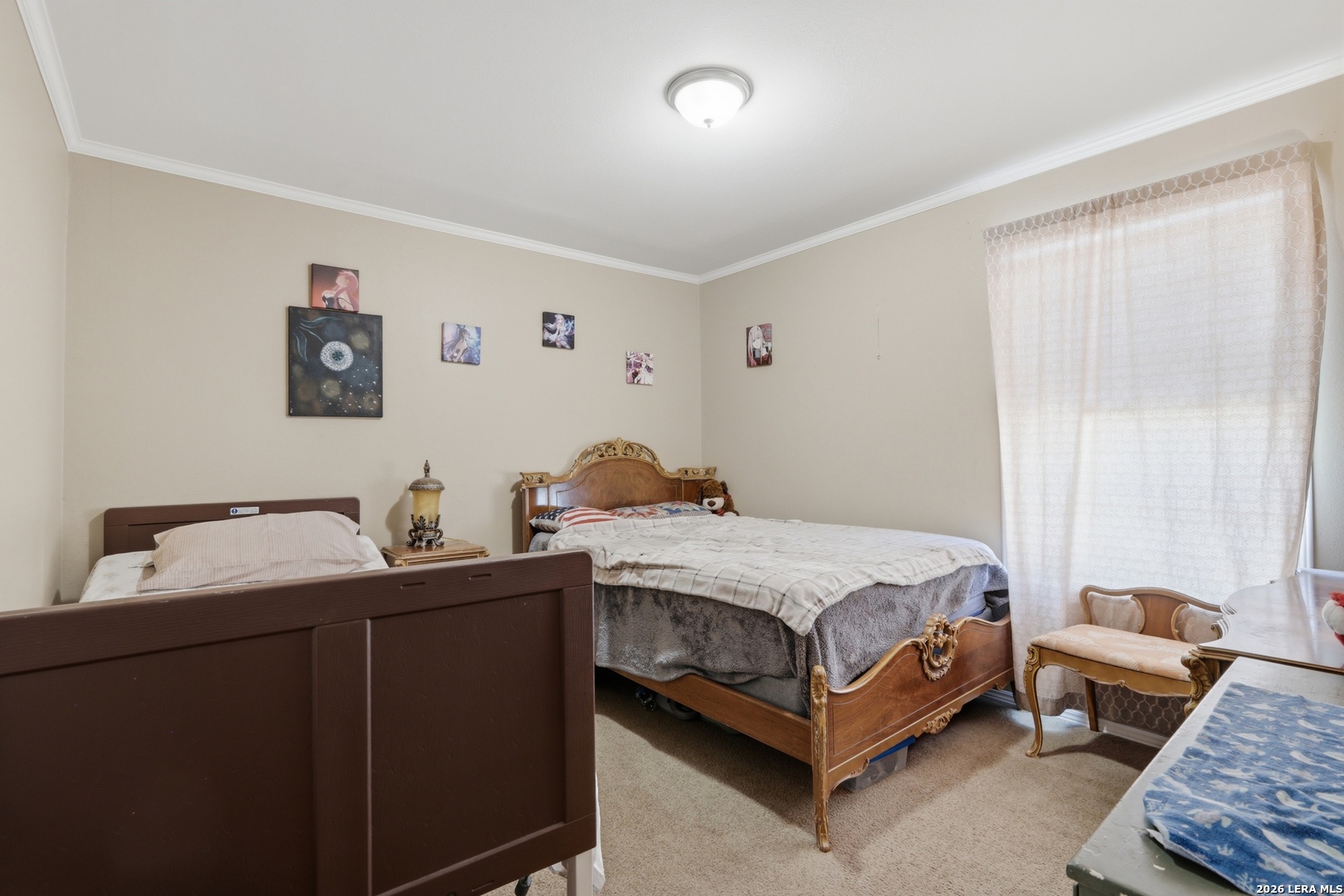 2145 Fm 2504 Poteet, TX 78065 - Photo 15 of 34 a bedroom with a bed and a dresser